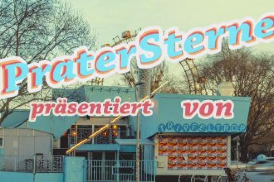 Das Praterstern-Gebäude in Wien mit der Aufschrift „Prater Sterne präsentiert von Traveltrop“.