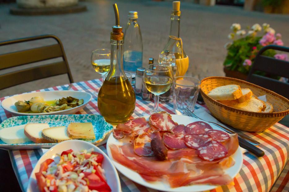 White wine and tasty italian homemade snack.