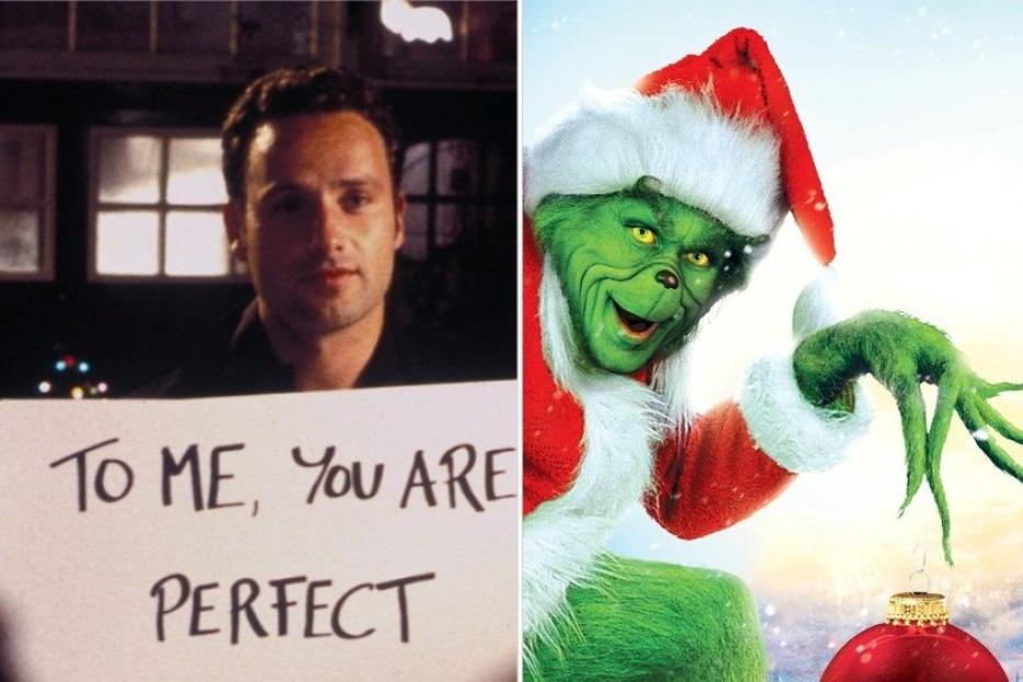 Ein Mann hält ein Schild mit der Aufschrift „To me, you are perfect“ neben dem Grinch.