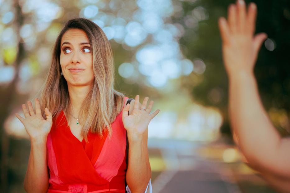 Person Pretending Not to See Someone Waving and Saluting