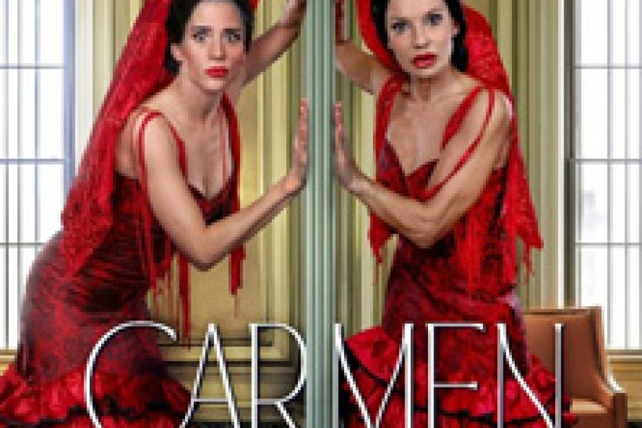 Zwei Frauen in roten Flamenco-Kleidern stehen an einem Spiegel, mit dem Titel „Carmen darf nicht platzen!“.
