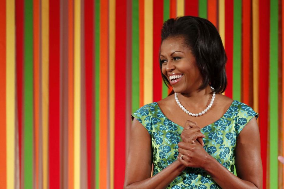 First lady Michelle Obama smiles at the first ever kids "State Dinner" at the White House in Washington