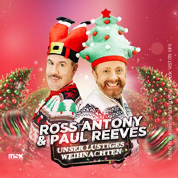 Ross Antony und Paul Reeves mit Weihnachtsmützen werben für „Unser lustiges Weihnachten“.