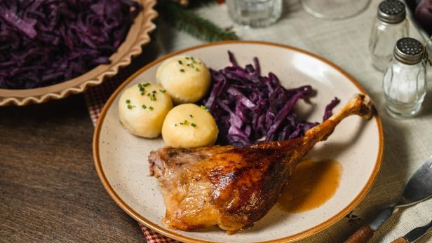 Delicious roast duck with red cabbage and dumplings