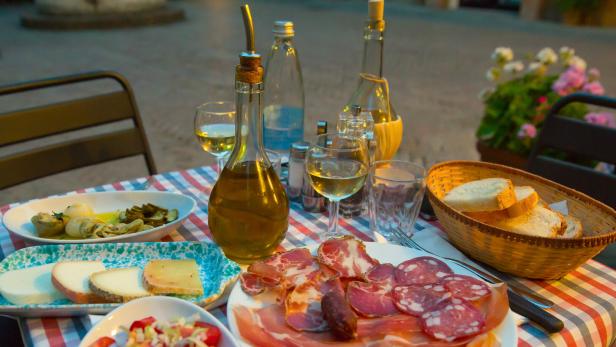 White wine and tasty italian homemade snack.