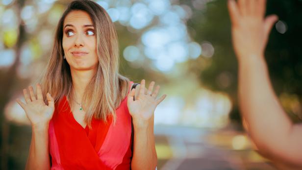 Person Pretending Not to See Someone Waving and Saluting