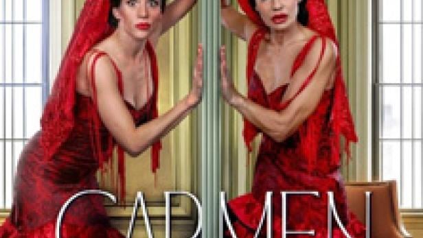 Zwei Frauen in roten Flamenco-Kleidern stehen an einem Spiegel, mit dem Titel „Carmen darf nicht platzen!“.